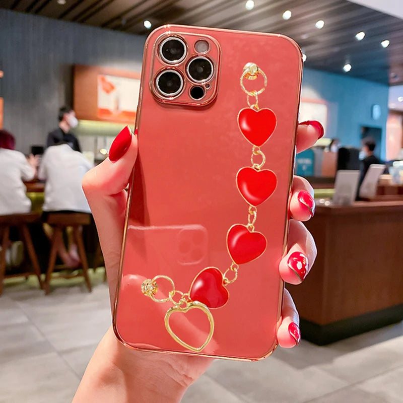 Funda con cadena y pulsera con forma de corazón chapado a la moda para iPhone 14, 15, 16 Pro Max Plus, funda a prueba de golpes