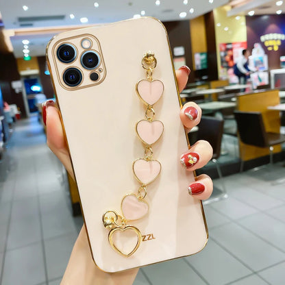 Funda con cadena y pulsera con forma de corazón chapado a la moda para iPhone 14, 15, 16 Pro Max Plus, funda a prueba de golpes